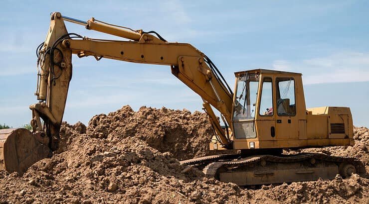 Photograph is showing the crawler excavator working productively with its idlers