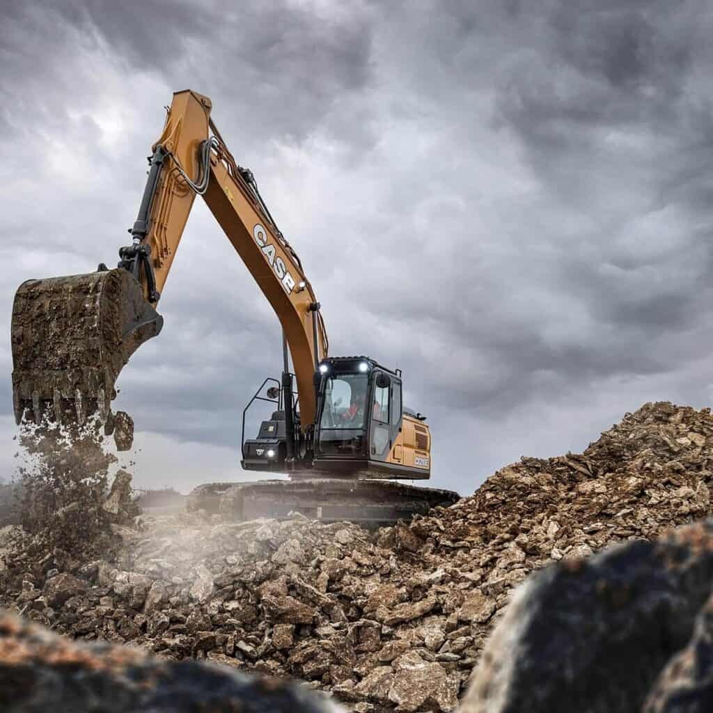 Photograph is showing the crawler excavator working productively with its long arm