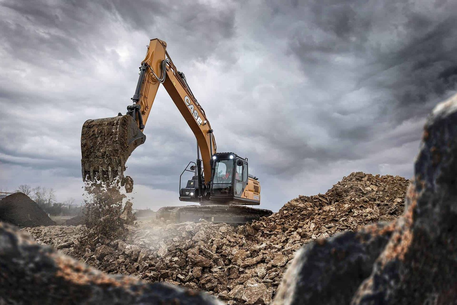 Photograph is showing the crawler excavator working productively with its long arm