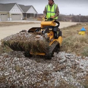 man operating a skid steer loader