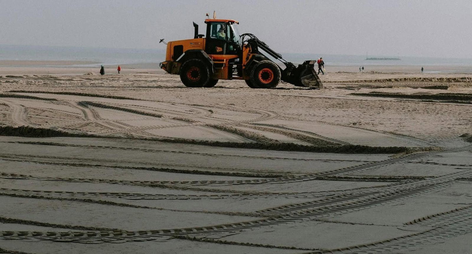 Tractor Smoothing Out Beach